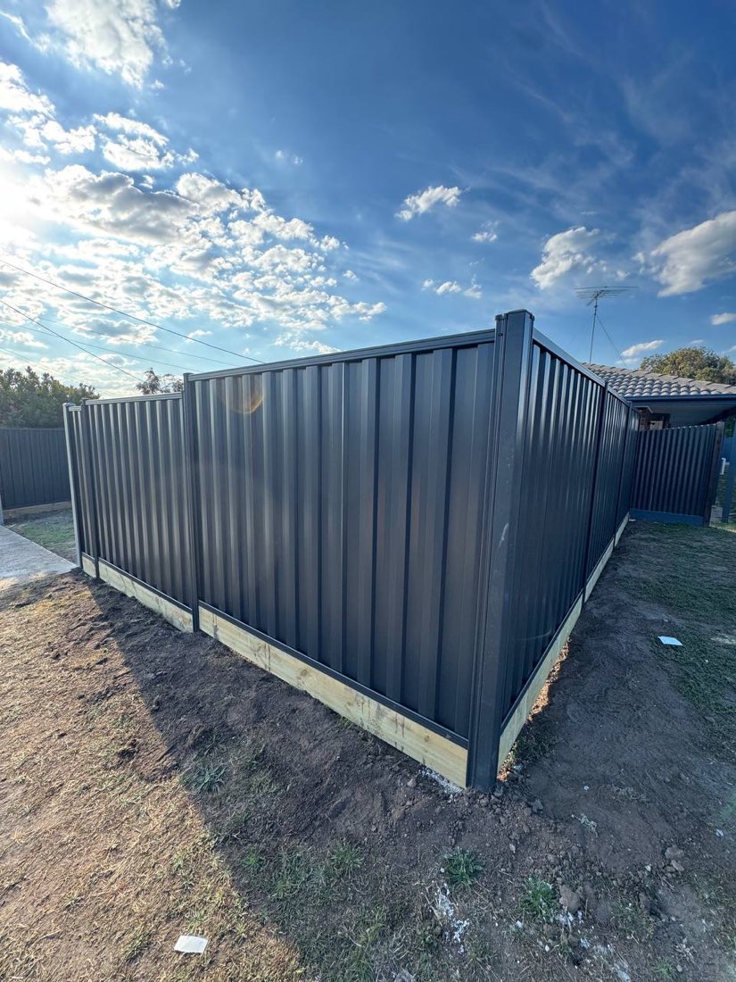 Colorbond steel fence in Monument grey, newly installed and returning around a corner boundary in Clifton Springs